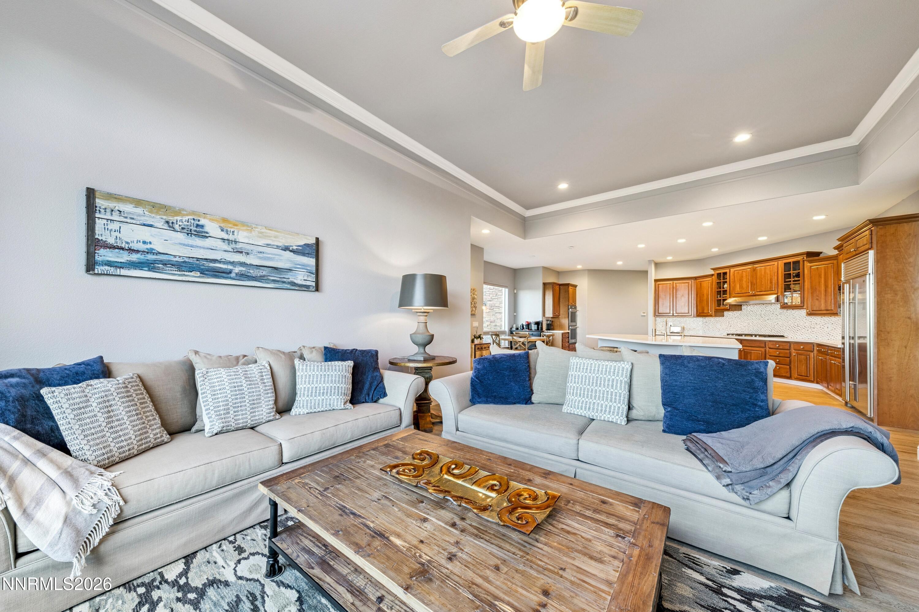 3670 Spirit Bluff Court Reno, NV 89511 - Photo 24 of 54 a living room with furniture fireplace and a table