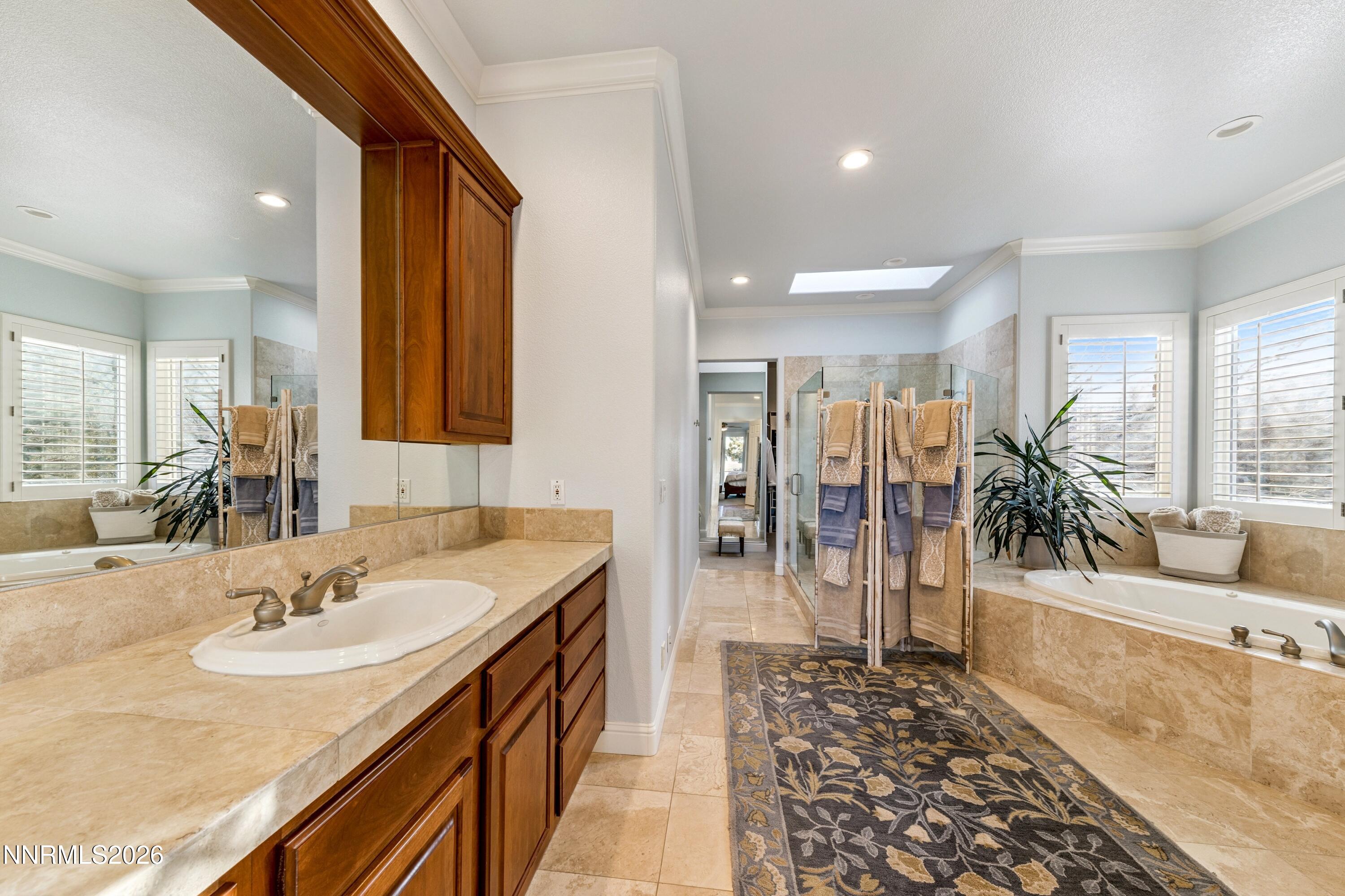 3670 Spirit Bluff Court Reno, NV 89511 - Photo 26 of 54 a bathroom with a tub sink and mirror