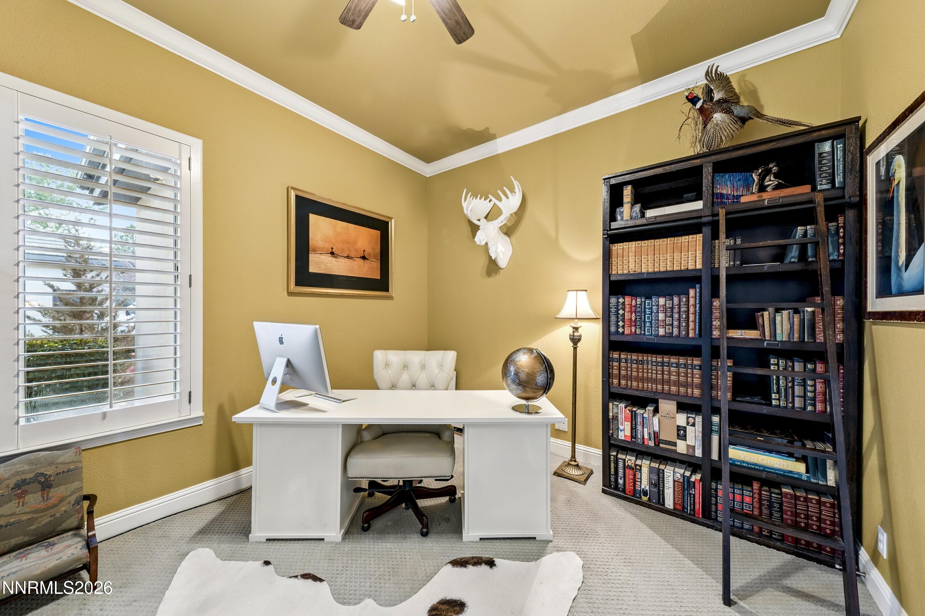 3670 Spirit Bluff Court Reno, NV 89511 - Photo 29 of 54 a reading room with furniture a book shelf and a window