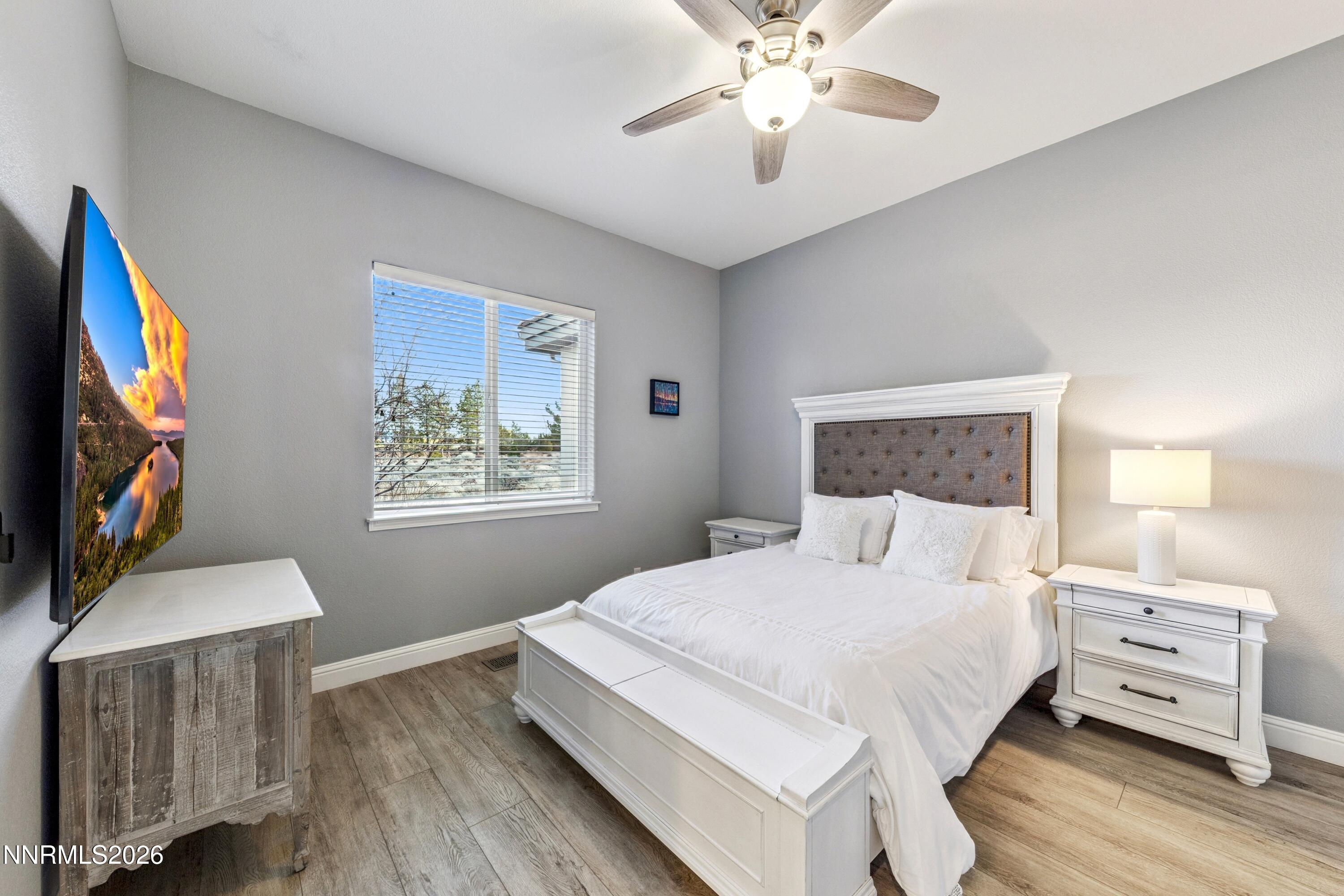 3670 Spirit Bluff Court Reno, NV 89511 - Photo 30 of 54 a bedroom with a bed and a flat screen tv