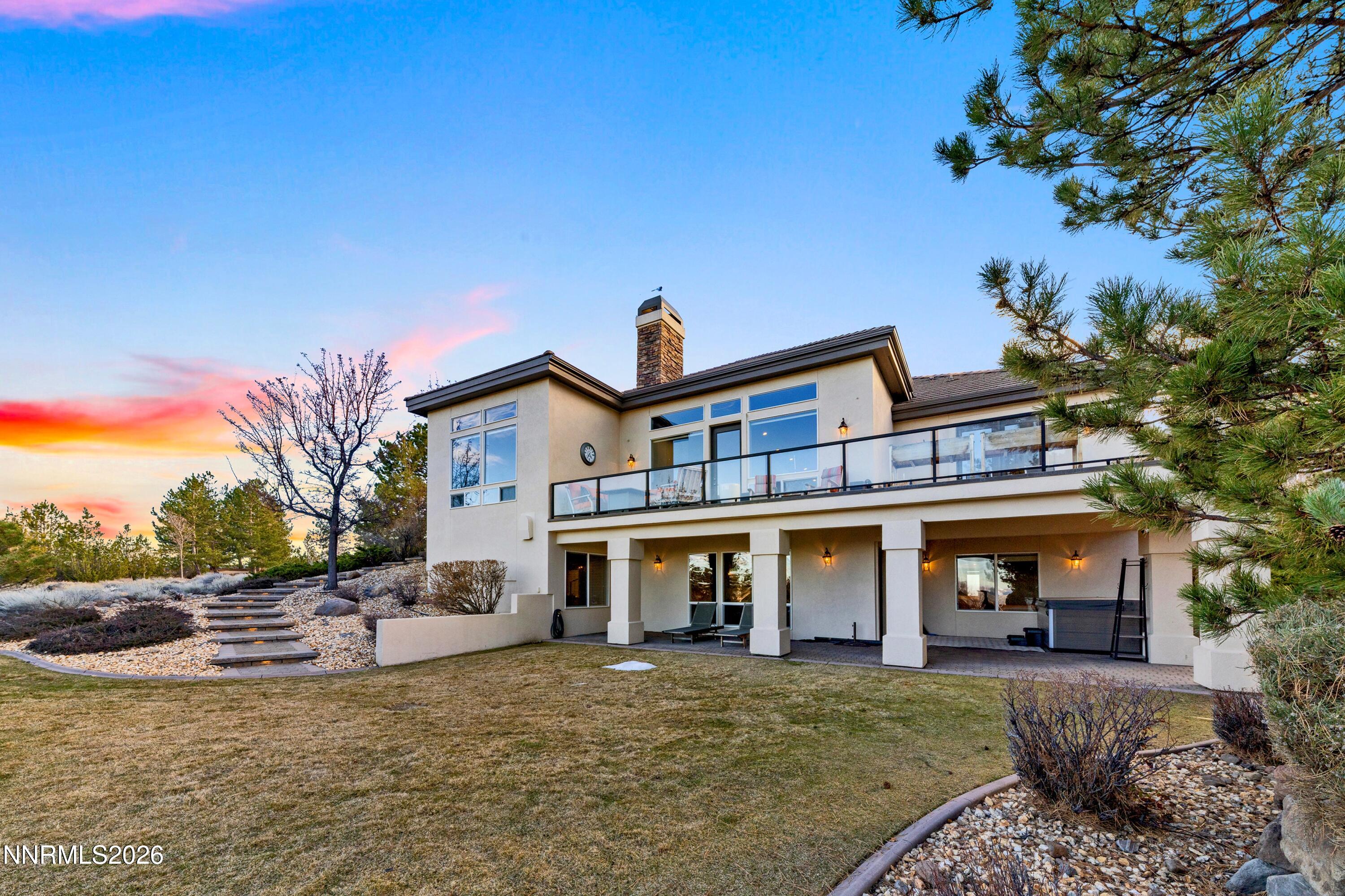 3670 Spirit Bluff Court Reno, NV 89511 - Photo 3 of 54 a front view of a house with garden
