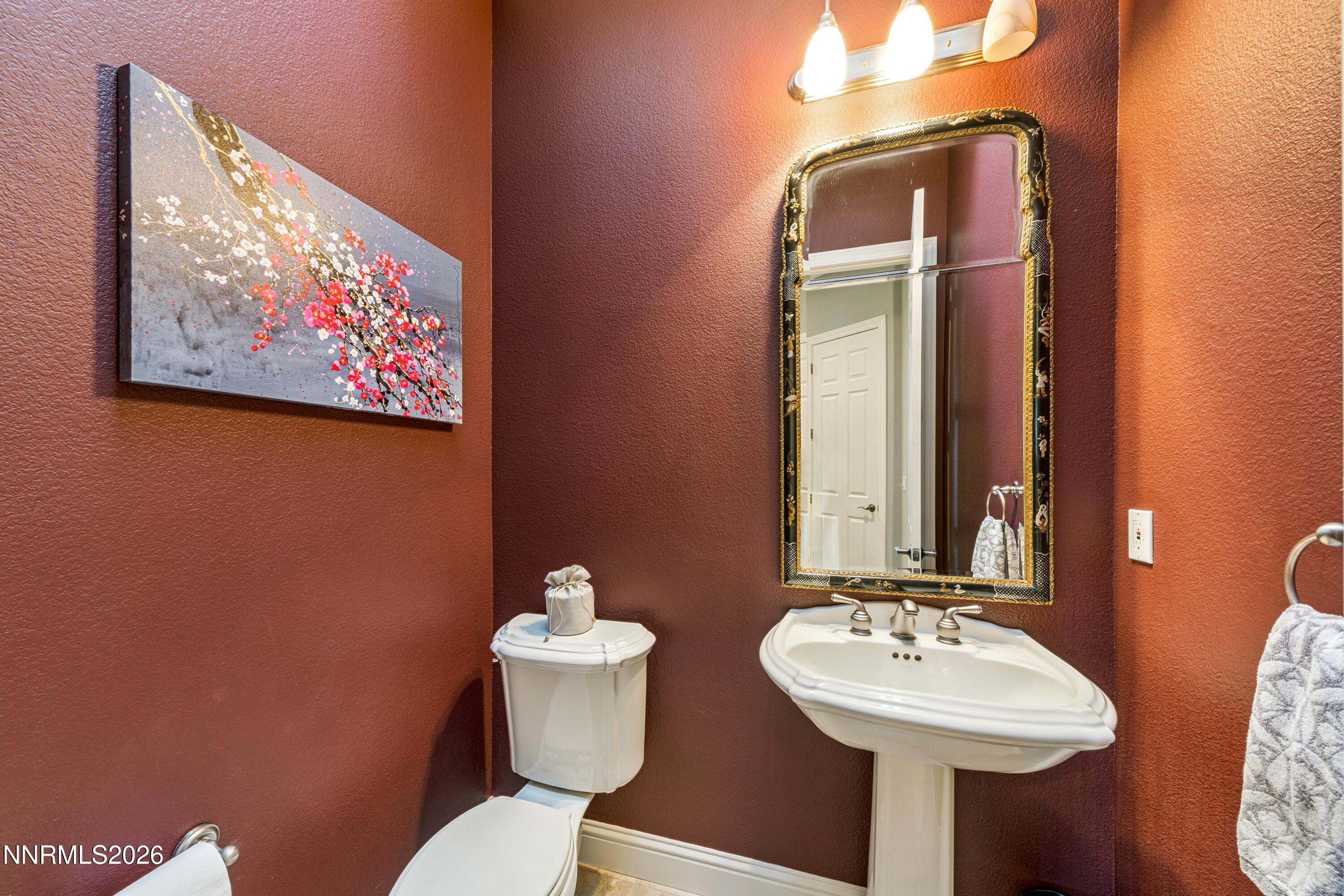 3670 Spirit Bluff Court Reno, NV 89511 - Photo 32 of 54 a bathroom with a sink mirror and toilet