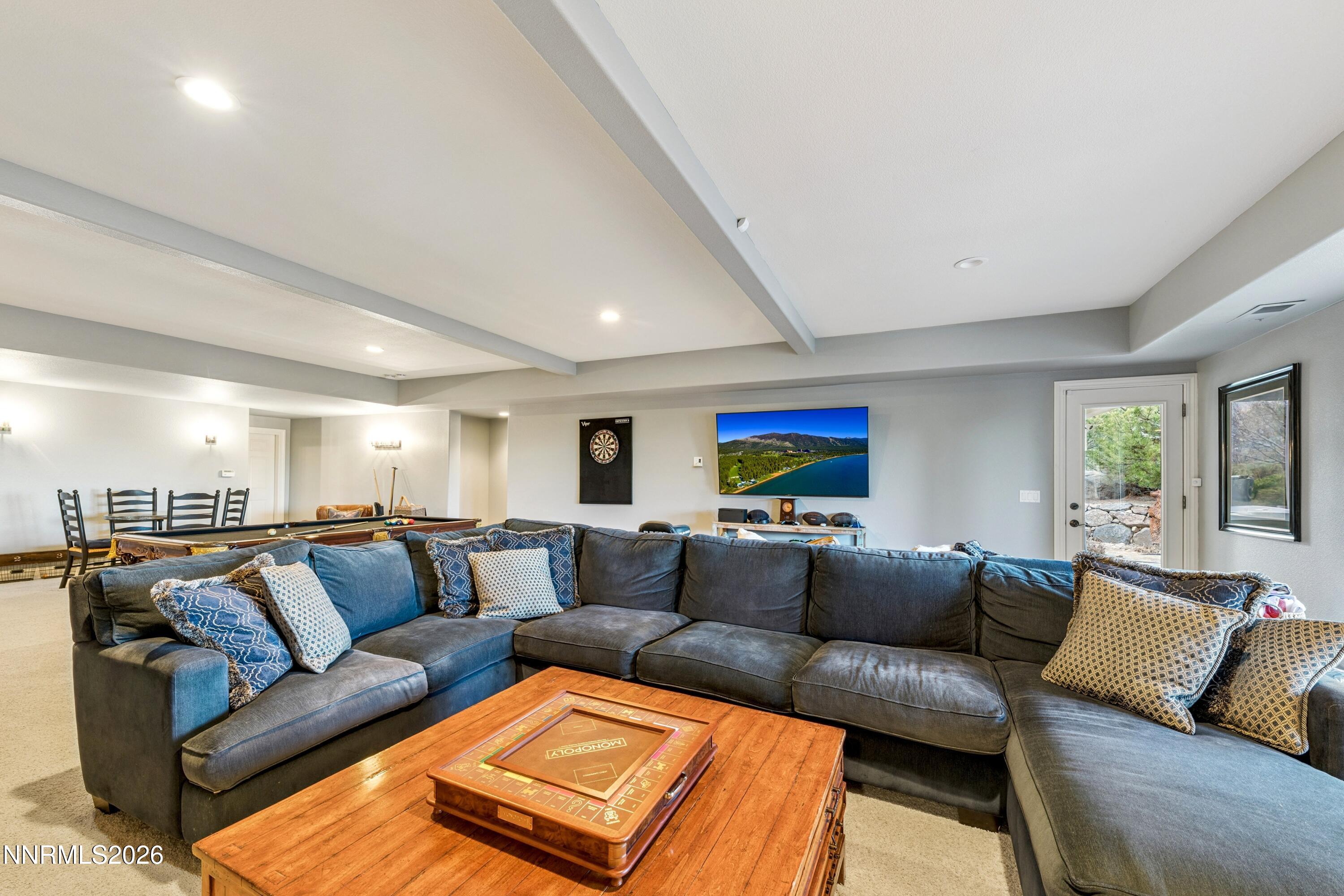 3670 Spirit Bluff Court Reno, NV 89511 - Photo 39 of 54 a living room with furniture and a flat screen tv