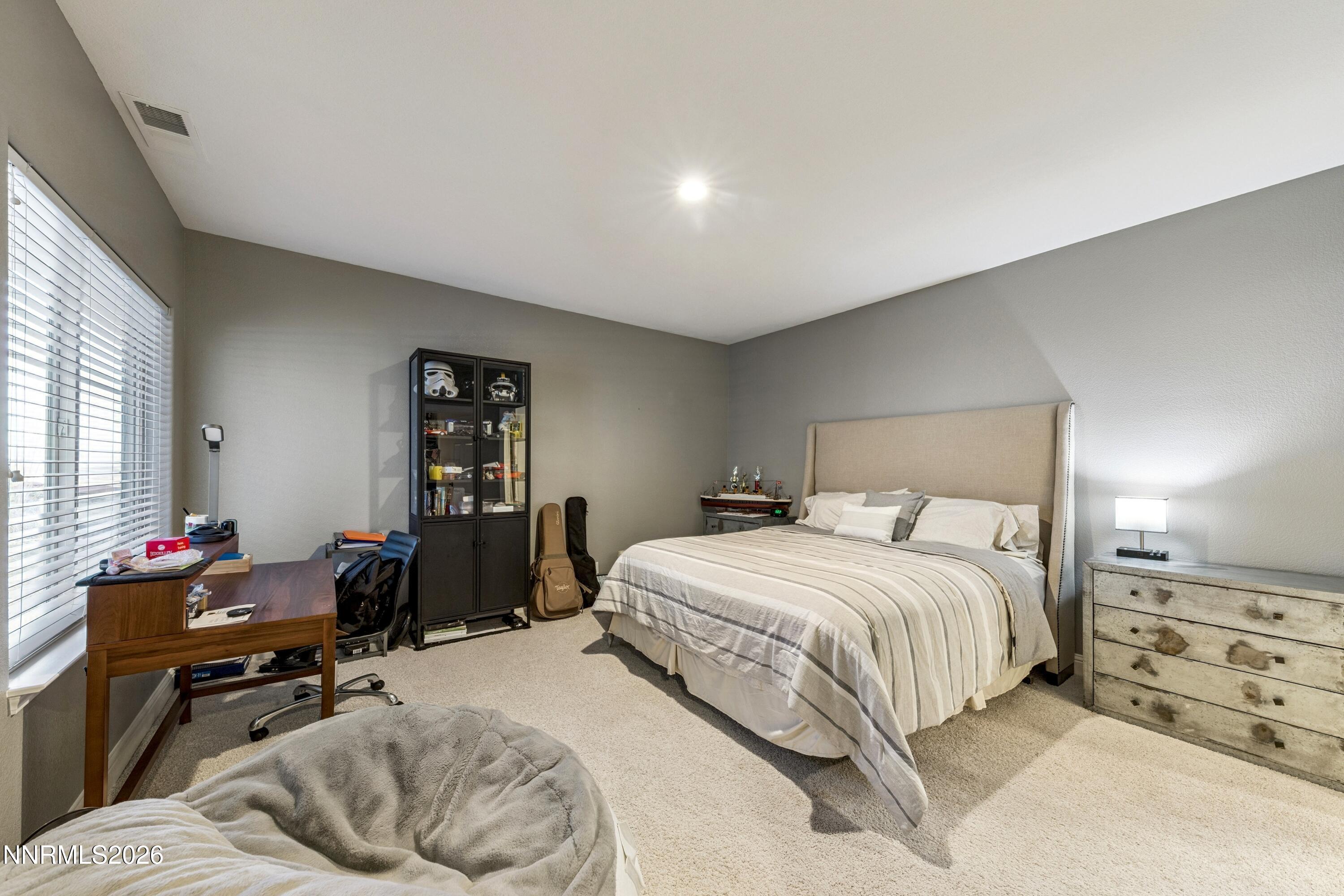 3670 Spirit Bluff Court Reno, NV 89511 - Photo 40 of 54 a bedroom with a bed and wooden floor