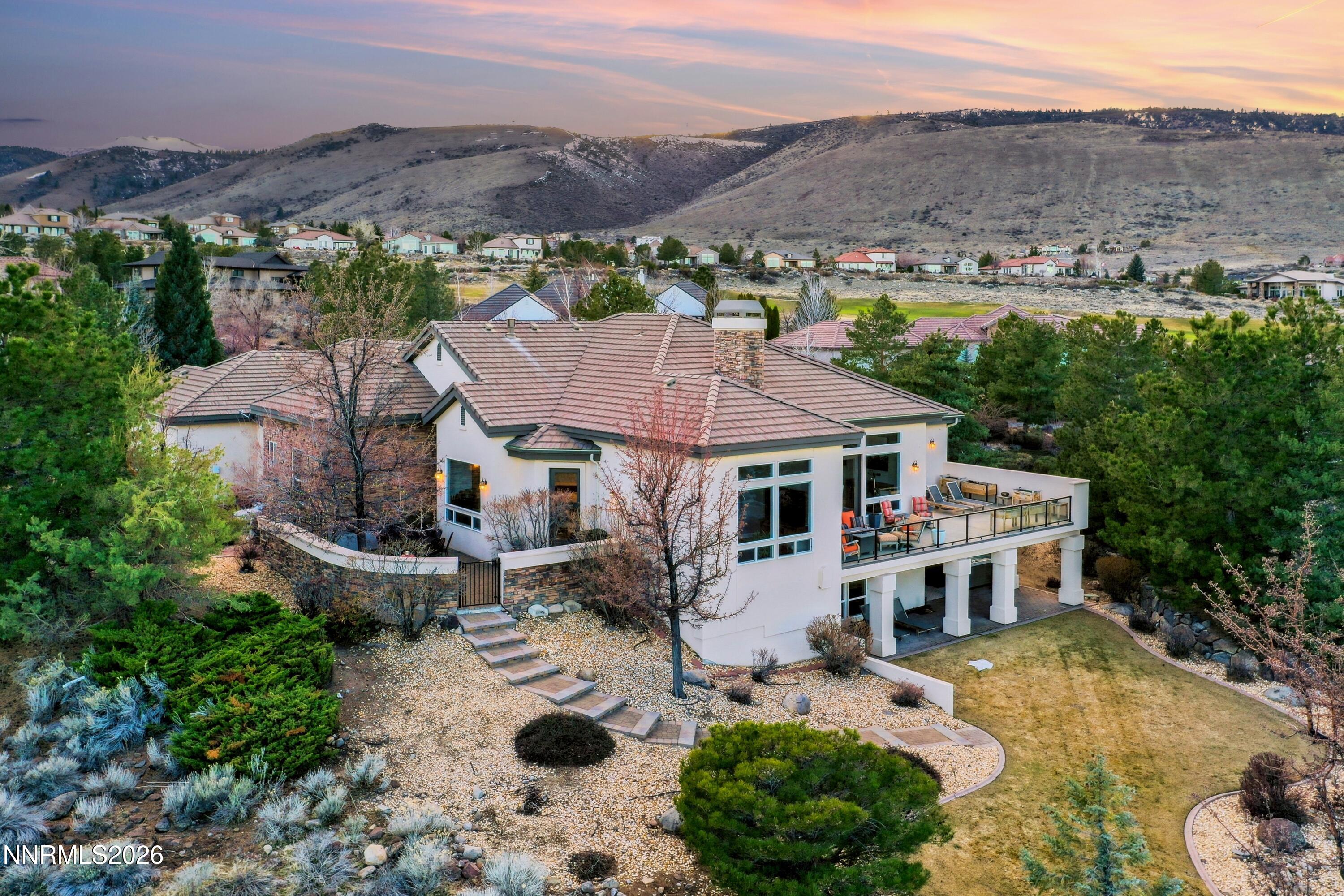 3670 Spirit Bluff Court Reno, NV 89511 - Photo 47 of 54 an aerial view of a house with yard and mountain view in back