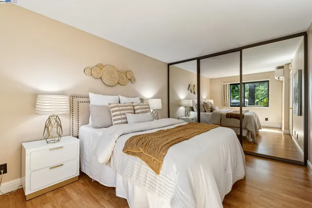 a bedroom with double bed and a large window