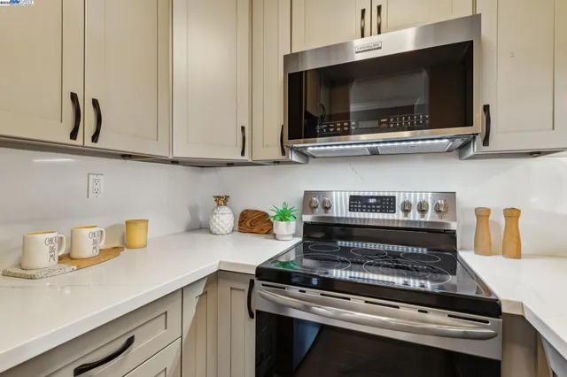 a kitchen with a stove and a microwave