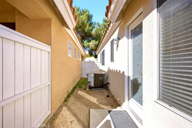 a bedroom with a bed a television and a couch