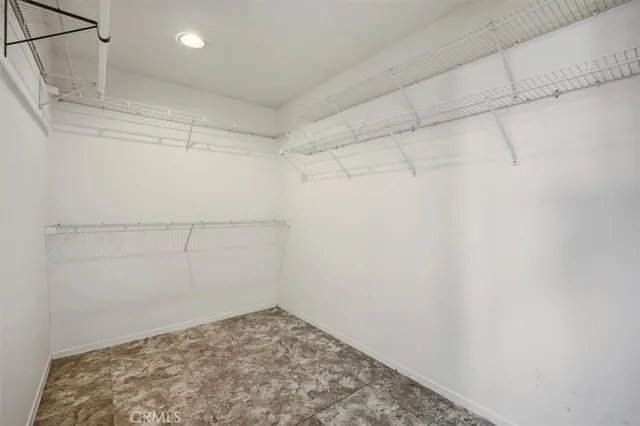 a view of storage and utility room with washer and dryer