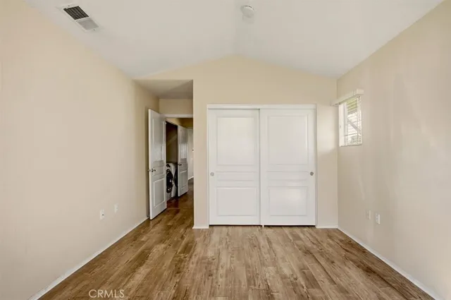 a view of a house with backyard and porch