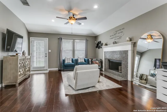 a living room with furniture and a fireplace