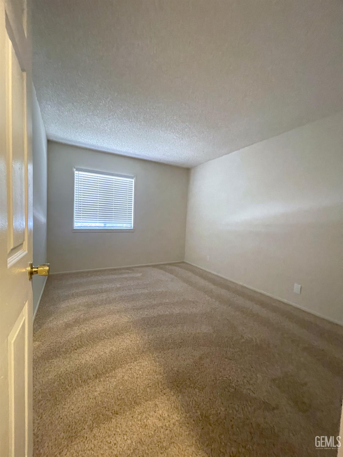 Undisclosed Address Tehachapi, CA 93561 - Photo 16 of 29 an empty room with a empty space and windows
