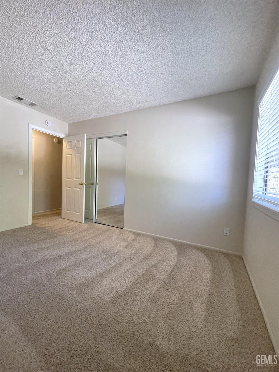 Undisclosed Address Tehachapi, CA 93561 - Photo 17 of 29 a view of an empty room with a window