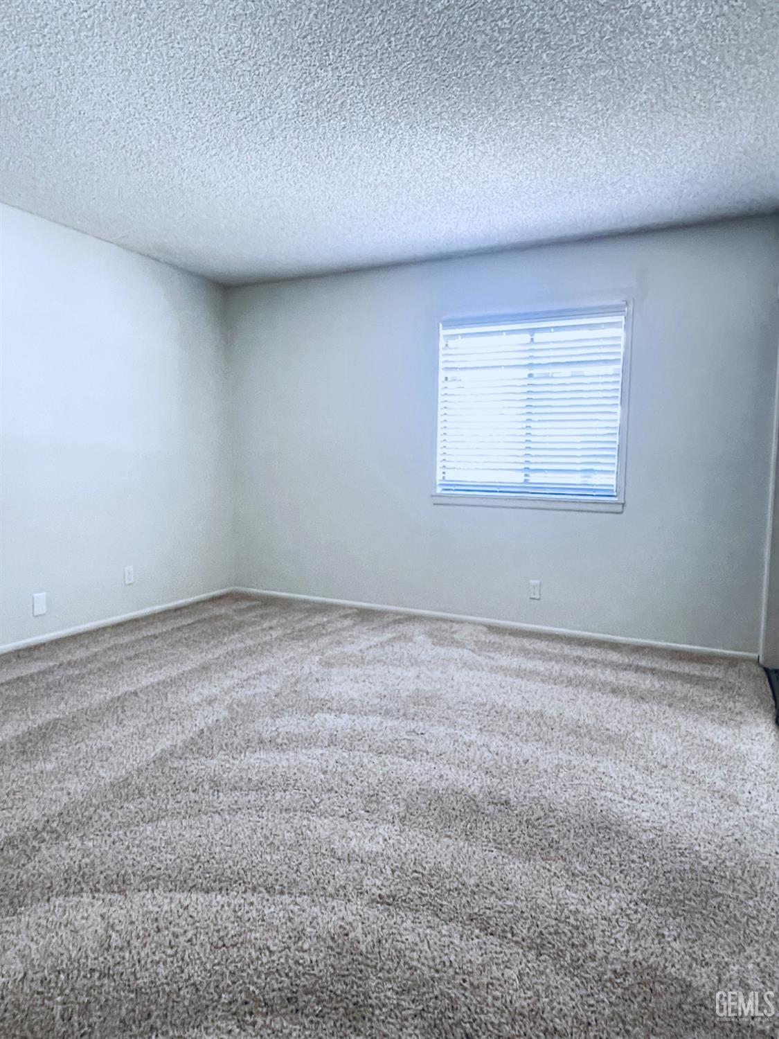 Undisclosed Address Tehachapi, CA 93561 - Photo 19 of 29 a view of an empty room with a window