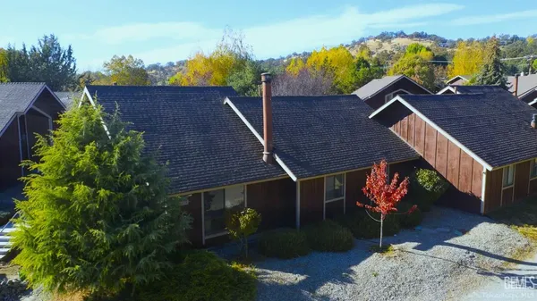 an aerial view of house with a yard