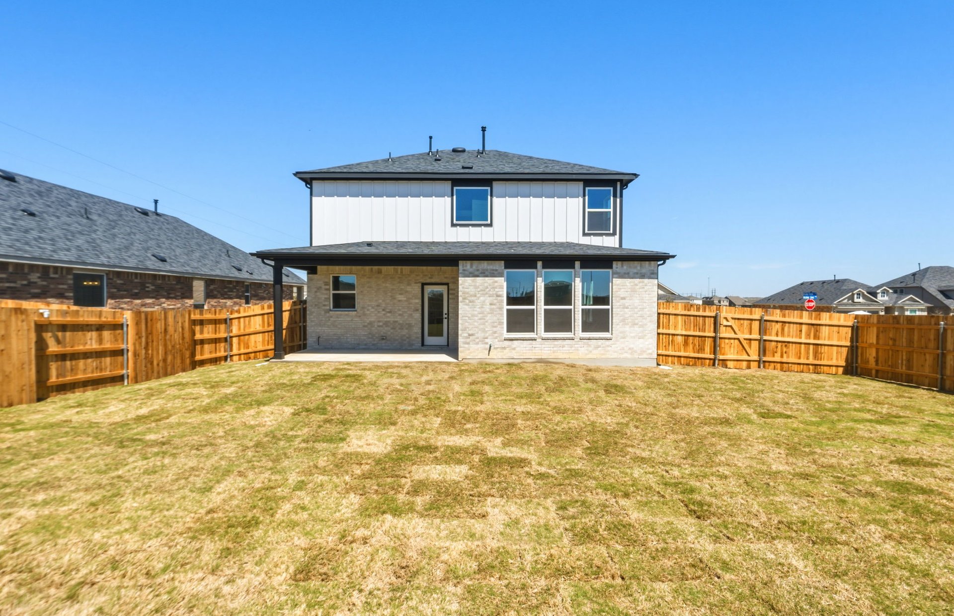 536 Rubber Tree Way Buda, TX 78610 - Photo 27 of 32 a front view of a house with a yard