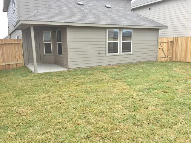 a view of house backyard and entertaining space