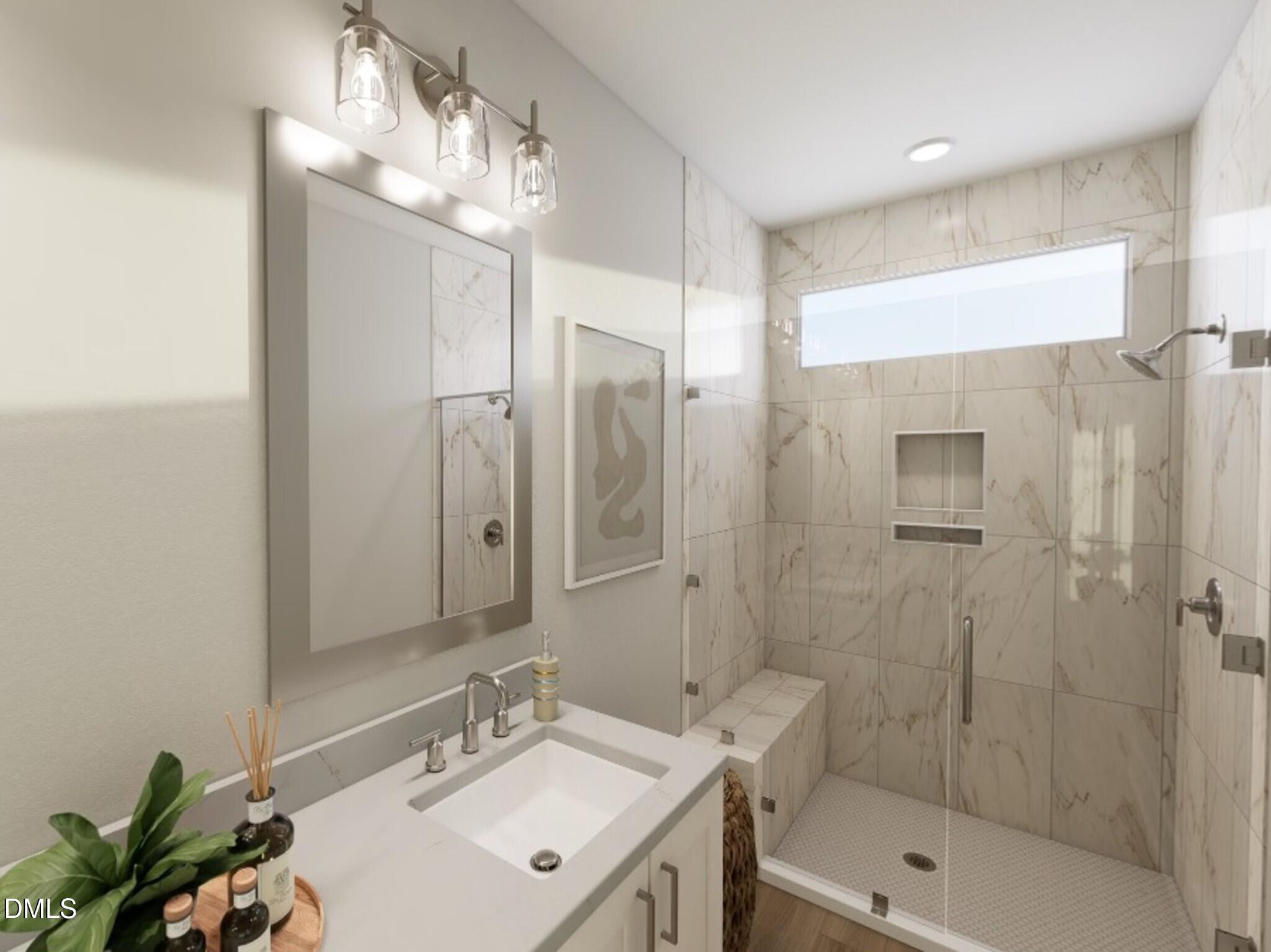 626 Cable Court Apex, NC 27523 - Photo 3 of 13 a bathroom with a shower a sink and mirror