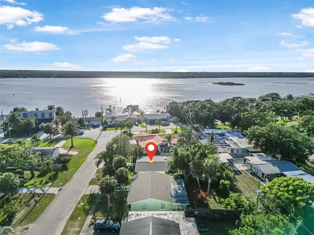 an aerial view of residential houses with outdoor space