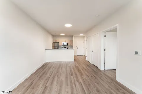 a view of kitchen with wooden floor