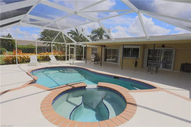 an aerial view of a house with swimming pool
