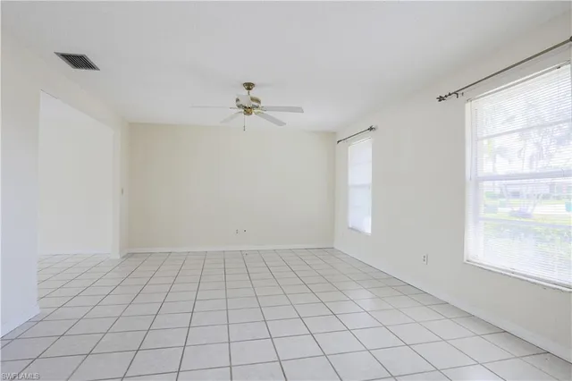 a view of an empty room and window