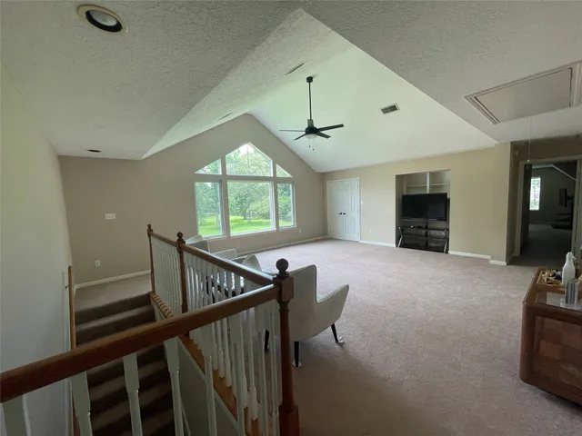 a view of livingroom with furniture and windows