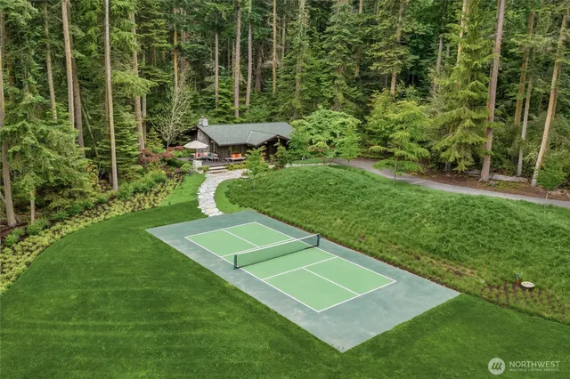 a view of a backyard with sitting area
