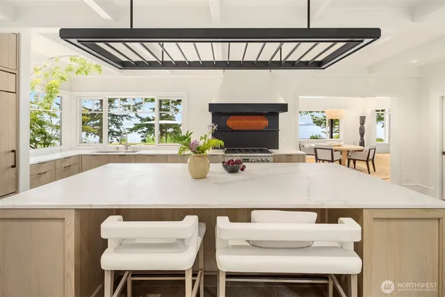 a kitchen with a table chairs and a microwave