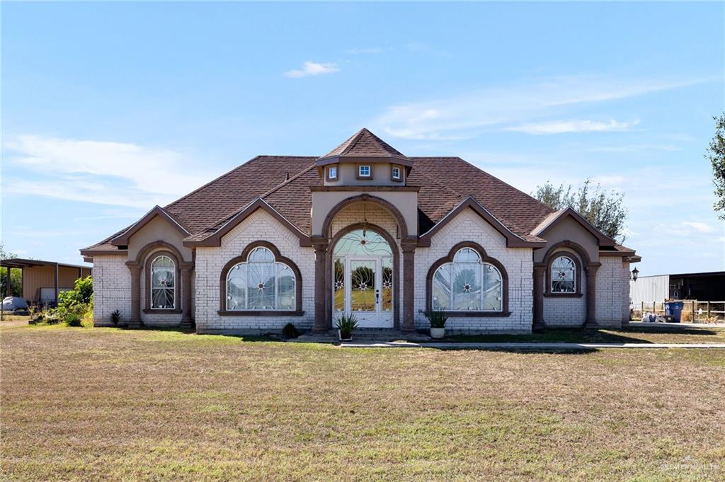 a front view of a house with a yard