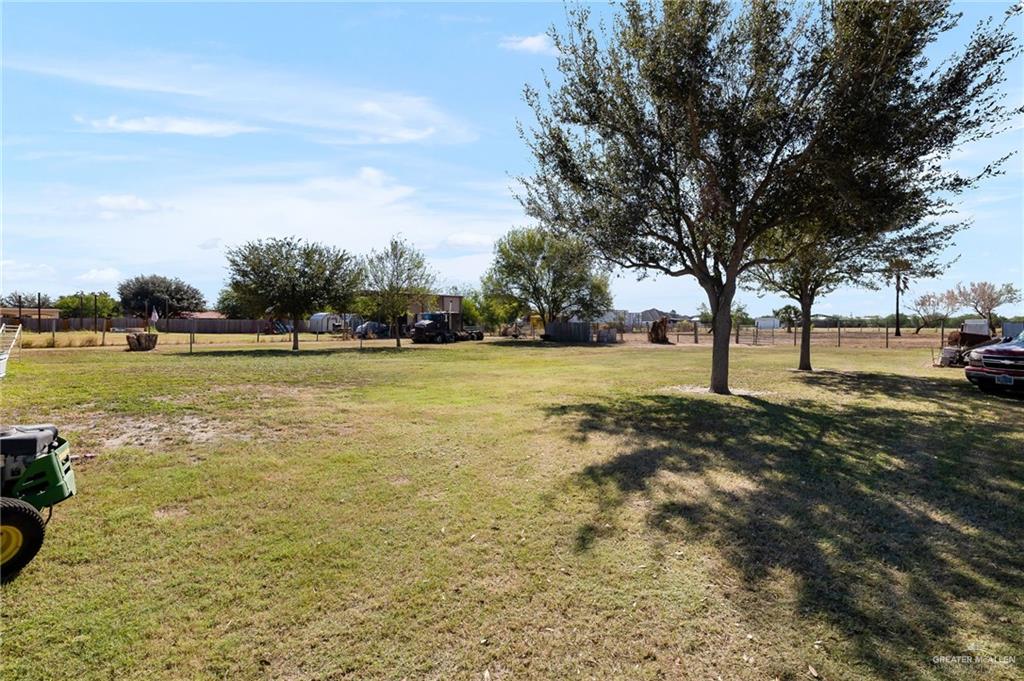 519 East Earling Road Alamo, TX 78516 - Photo 11 of 16 a view of yard with swimming pool and trees