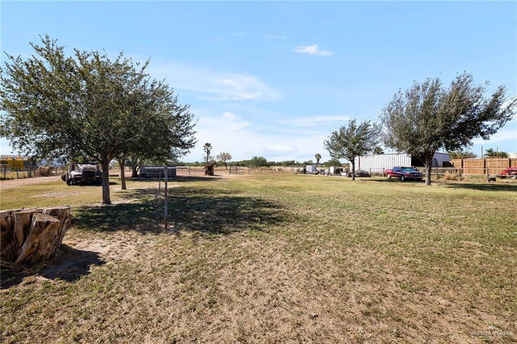 519 East Earling Road Alamo, TX 78516 - Photo 12 of 16 a view of a yard with a table and chairs