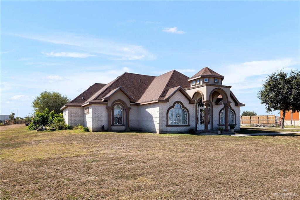 519 East Earling Road Alamo, TX 78516 - Photo 3 of 16 front view of a house with a yard