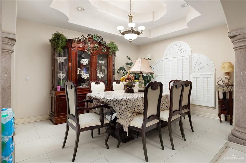 519 East Earling Road Alamo, TX 78516 - Photo 6 of 16 a view of a dining room with furniture and a chandelier