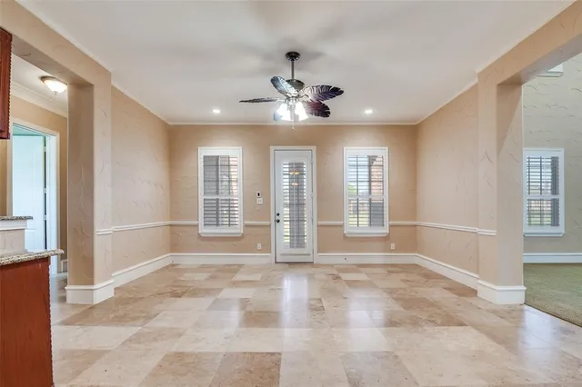 a view of a kitchen with a sink and a refrigerator