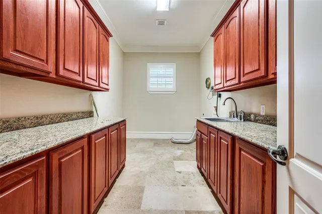 a bathroom with a granite countertop toilet sink and mirror