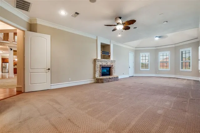 a view of an empty room with a fireplace