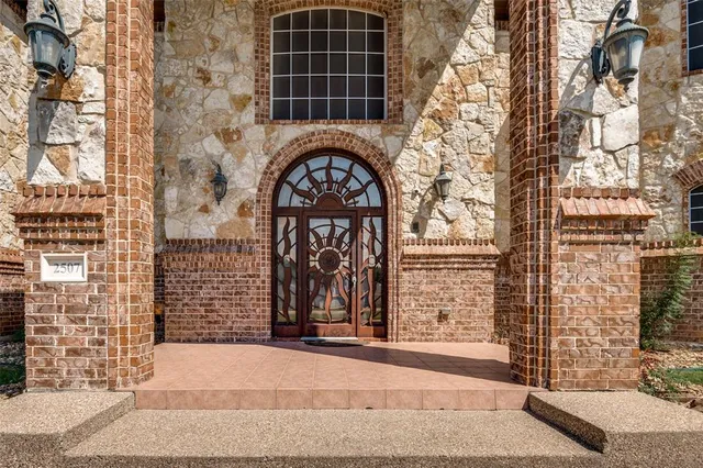 a front view of a building with a couple of windows