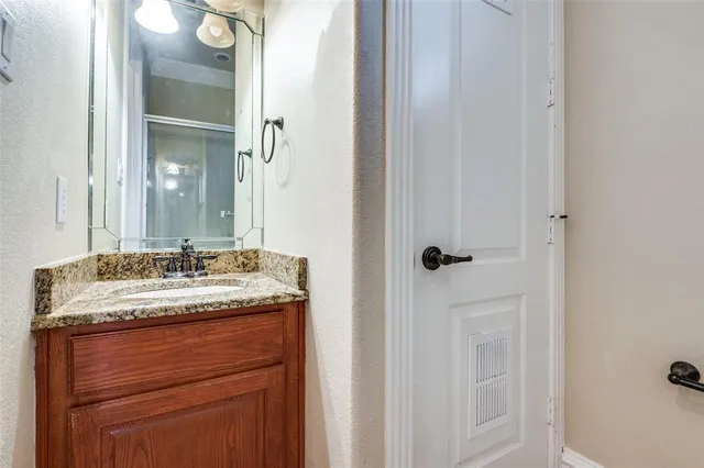 a hallway with cabinets and wooden floor