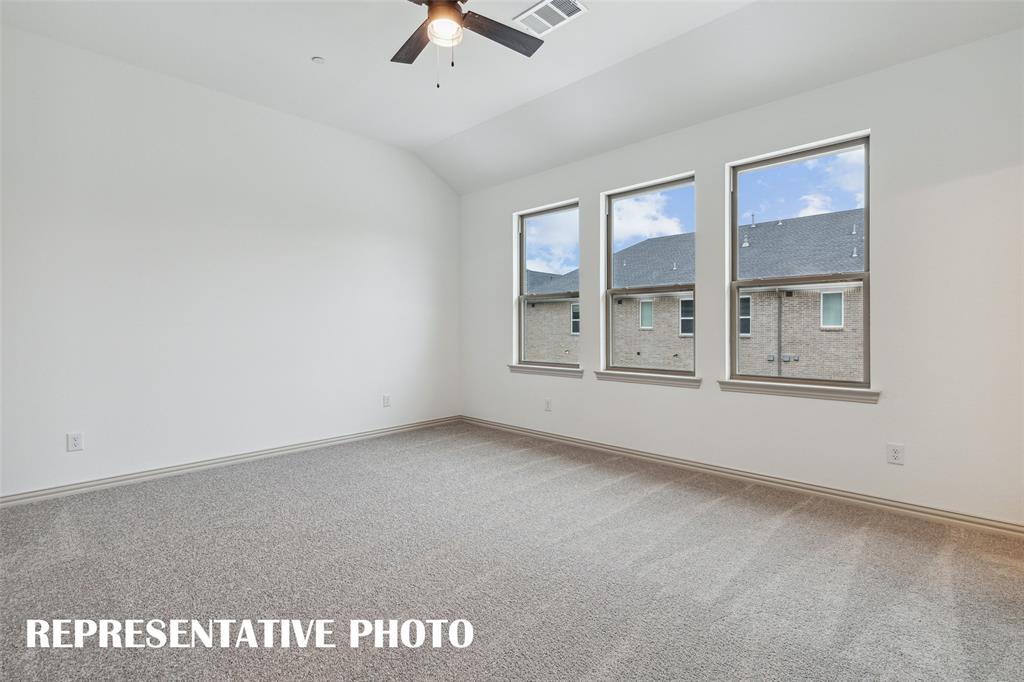 220 Dylan Way Midlothian, TX 76065 - Photo 15 of 16 an empty room with windows and ceiling fan