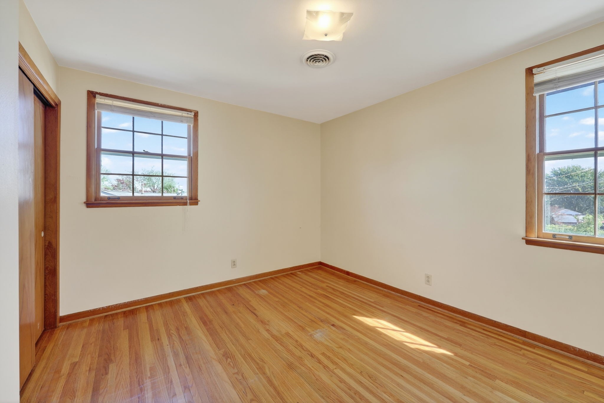 103 Fischer Drive Springfield, TN 37172 - Photo 29 of 45 an empty room with wooden floor and windows