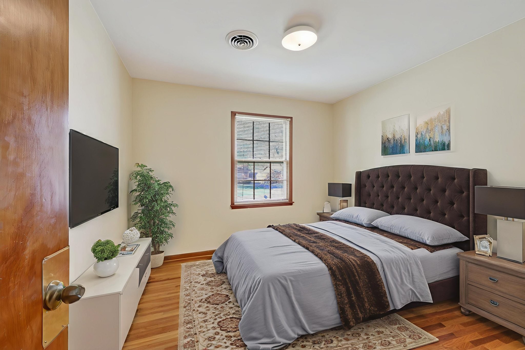 103 Fischer Drive Springfield, TN 37172 - Photo 43 of 45 a bedroom with a large bed and a potted plant