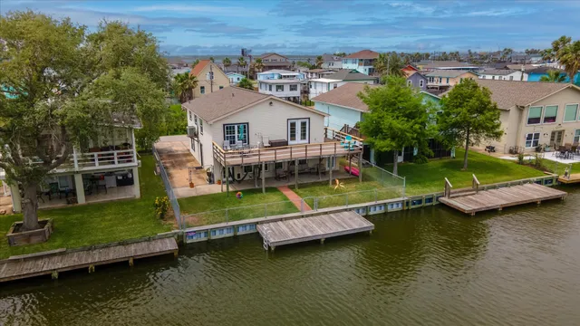 an aerial view of a house with a big yard