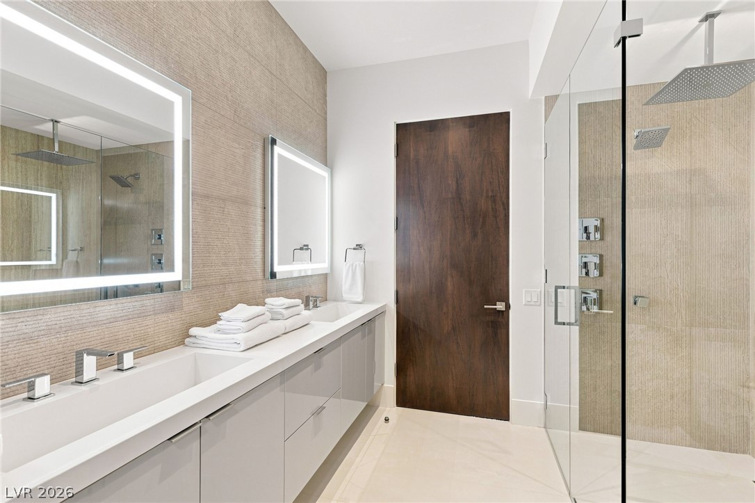 677 Overlook Rim Drive Henderson, NV 89012 - Photo 54 of 97 Sleek contemporary design defines this modern space with clean lines and premium stone finishes.