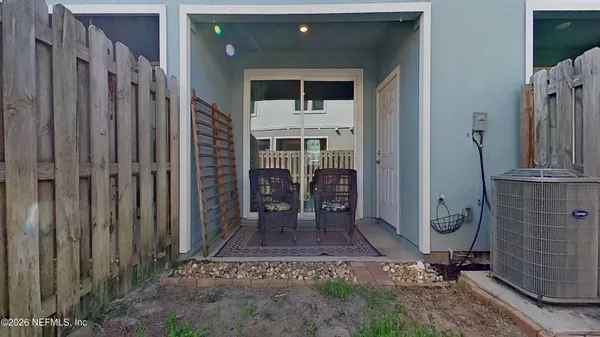 a front view of a house with a wooden fence