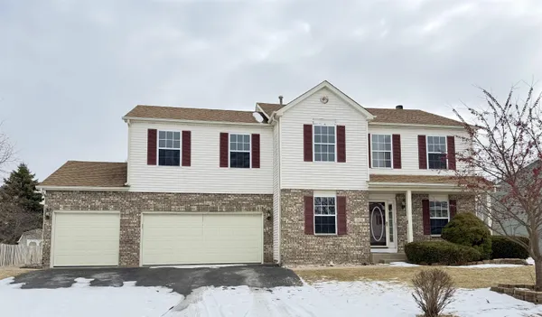 a front view of a house with yard