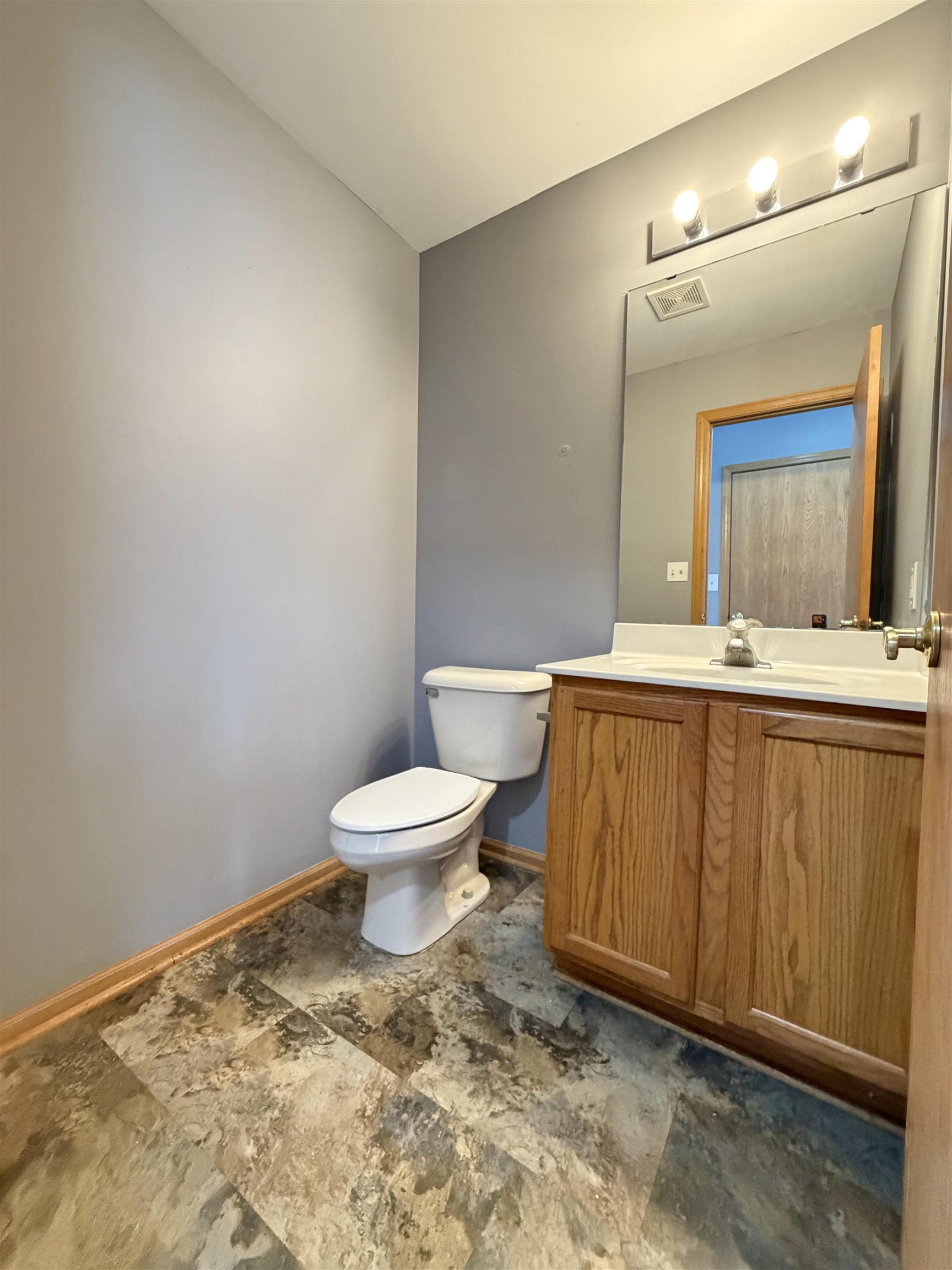 2424 Winfield Lane Belvidere, IL 61008 - Photo 11 of 30 a bathroom with a toilet sink and mirror