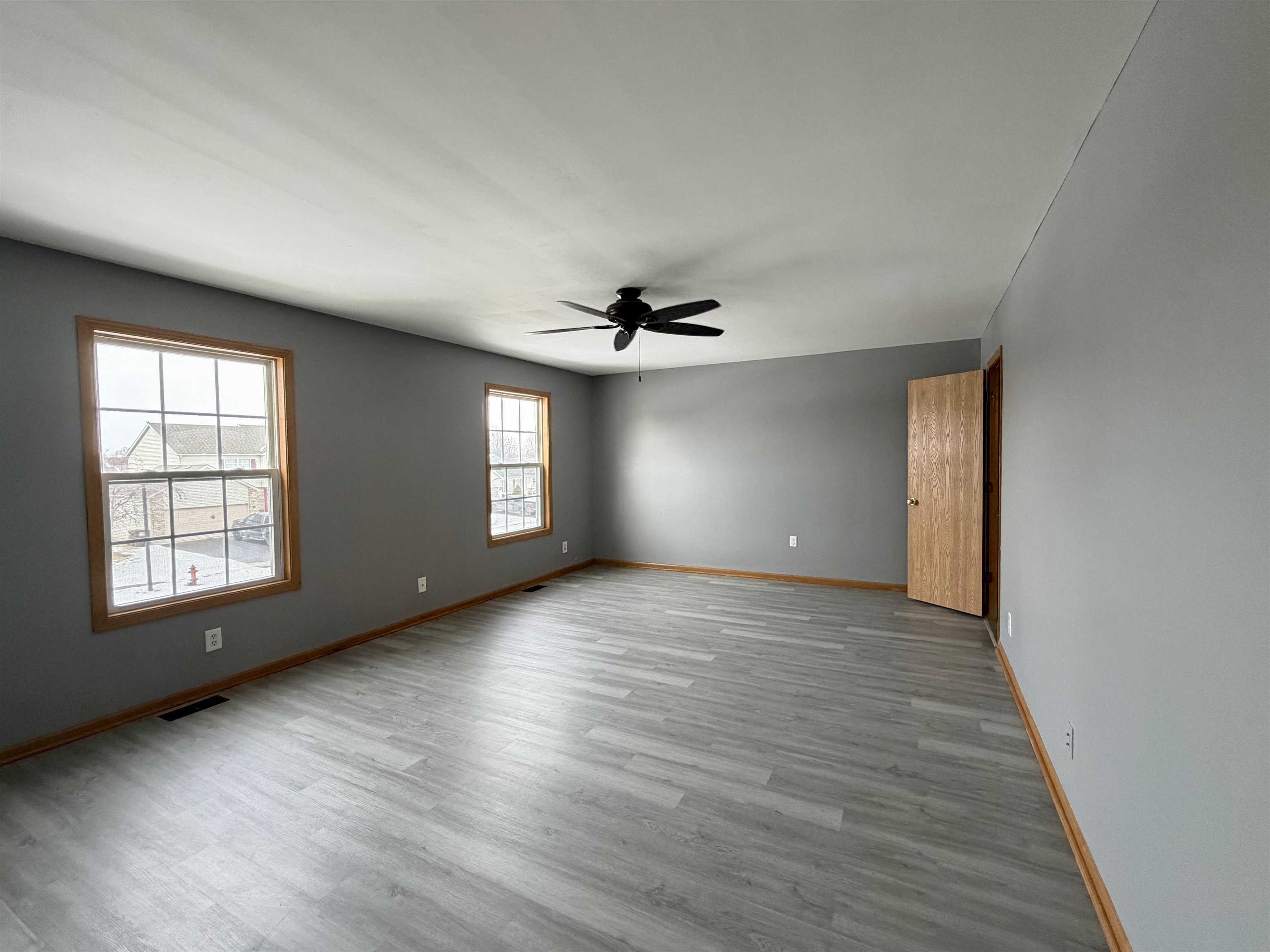 2424 Winfield Lane Belvidere, IL 61008 - Photo 13 of 30 an empty room with wooden floor and windows