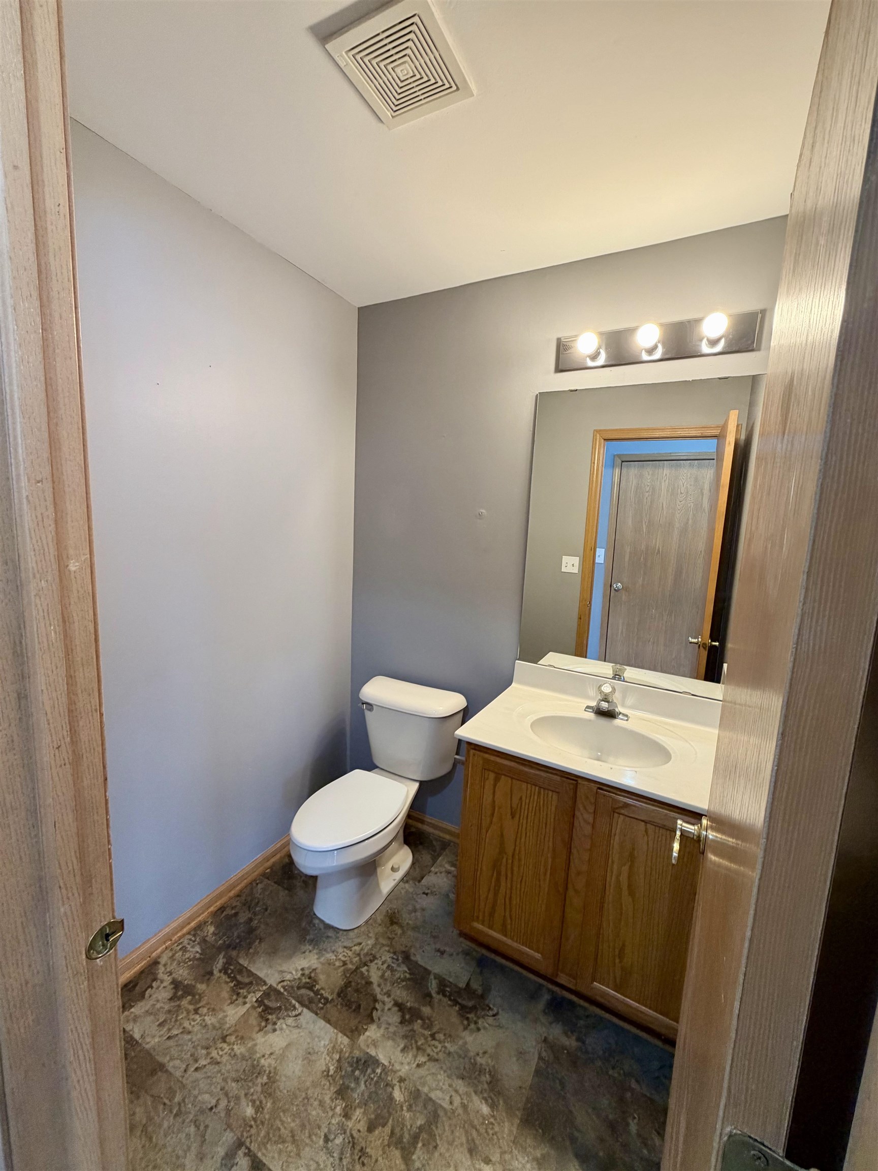 2424 Winfield Lane Belvidere, IL 61008 - Photo 19 of 30 a bathroom with a sink toilet and mirror