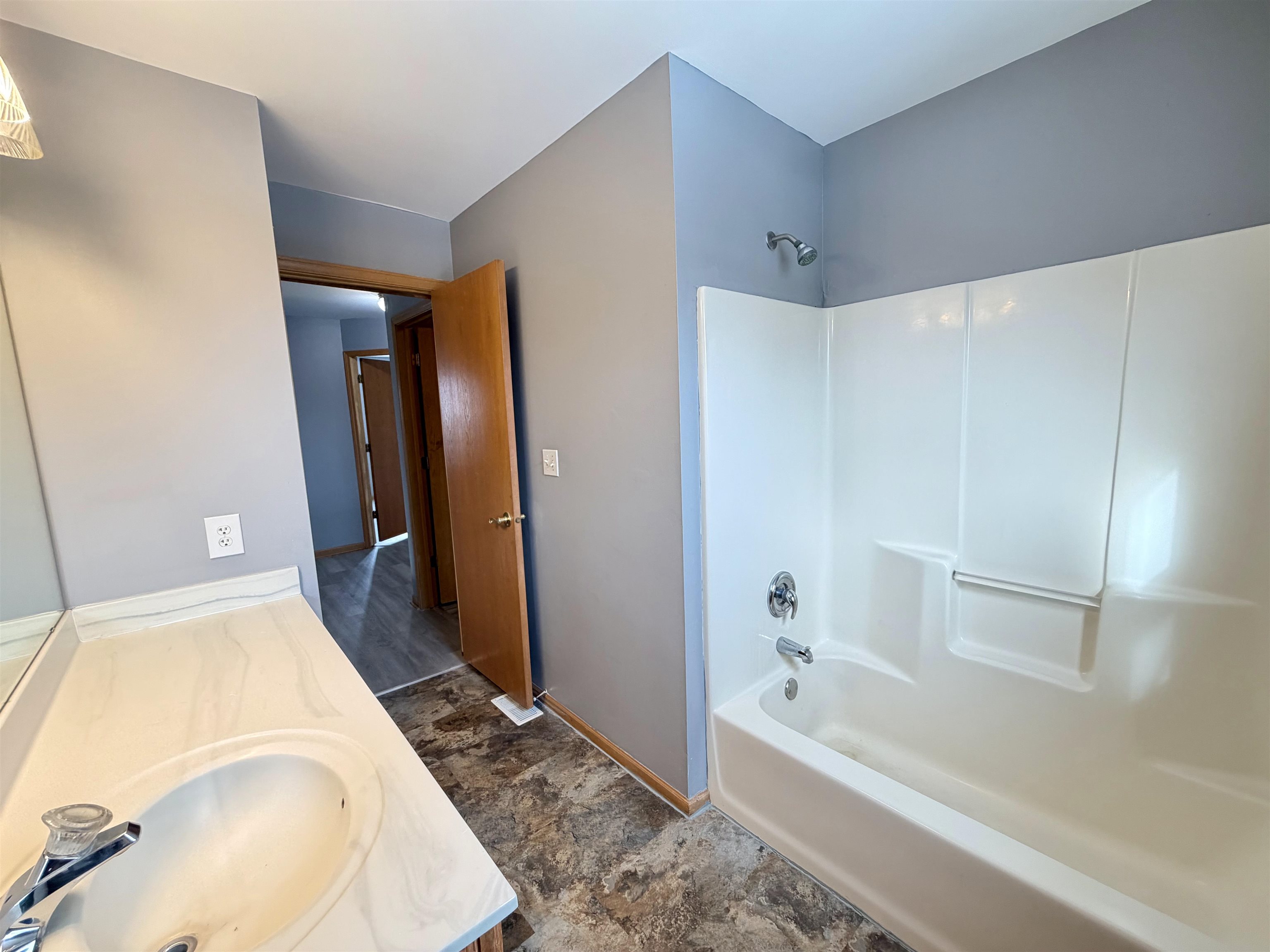 2424 Winfield Lane Belvidere, IL 61008 - Photo 24 of 30 a bathroom with a tub and a sink